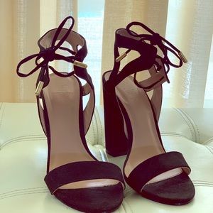 Black suede chunky heels sandals.